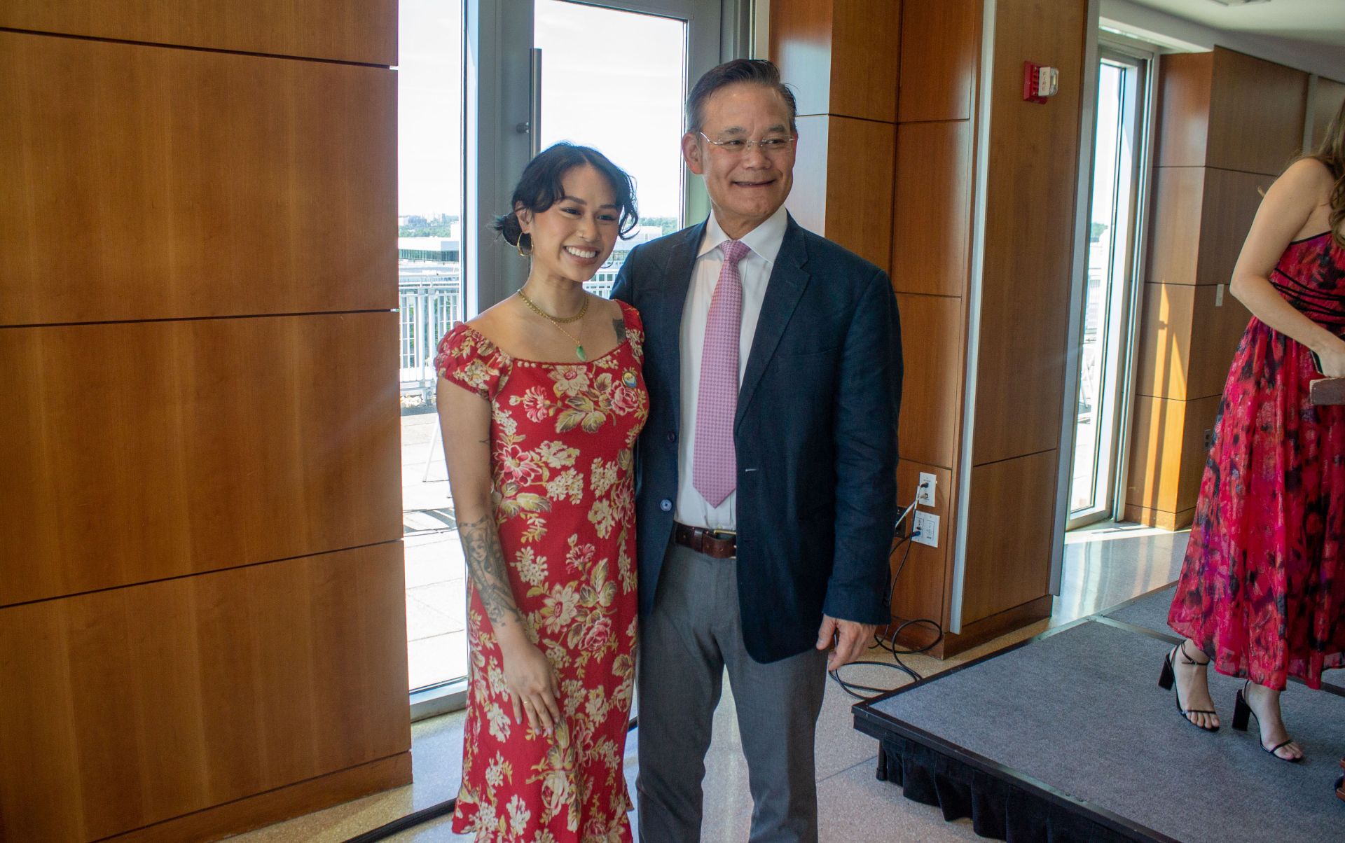 program director and student smiling