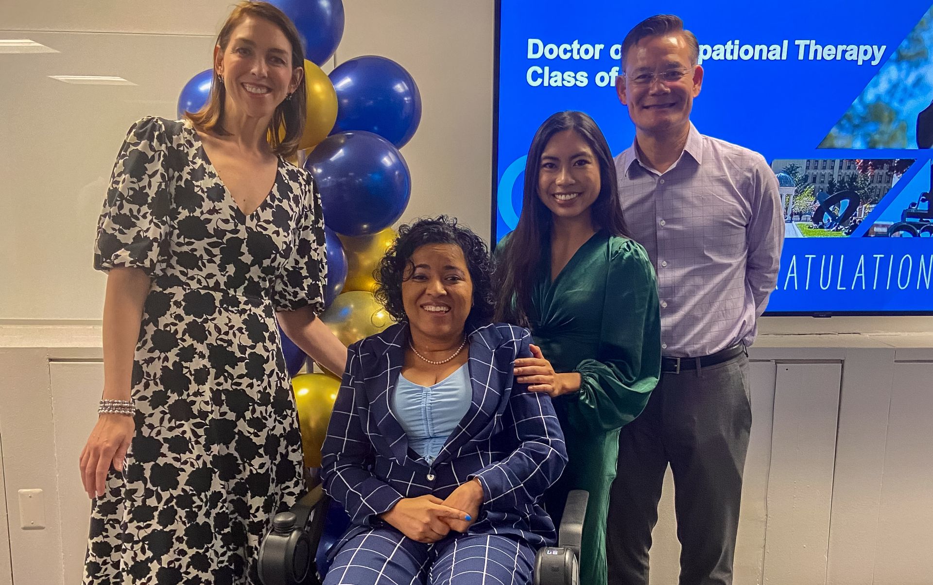 GW OT Faculty smiling with graduates