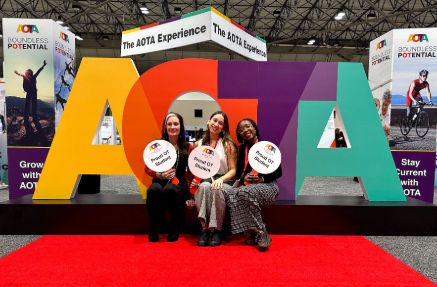 OT Students in front of AOTA sign