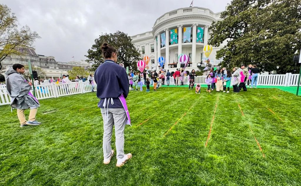 GW OT Student supervising easter egg roll activity