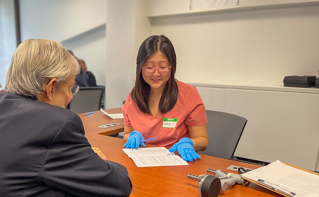 Jenny Kim Conducting Vision Screening