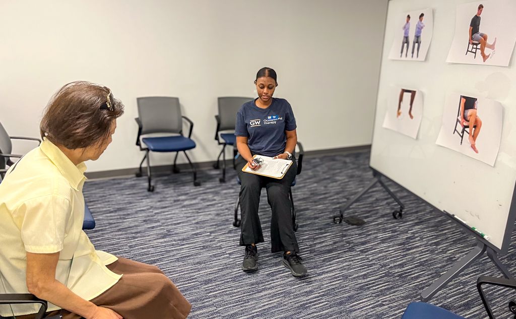 Kanya Syllien providing exercise demonstration