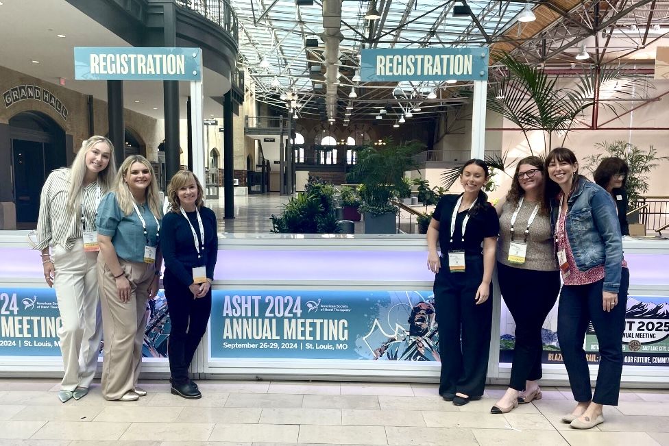 Dr. Sarah Doerrer and Dr. Laurie Rogers with GW OT Students at ASHT Annual Meeting