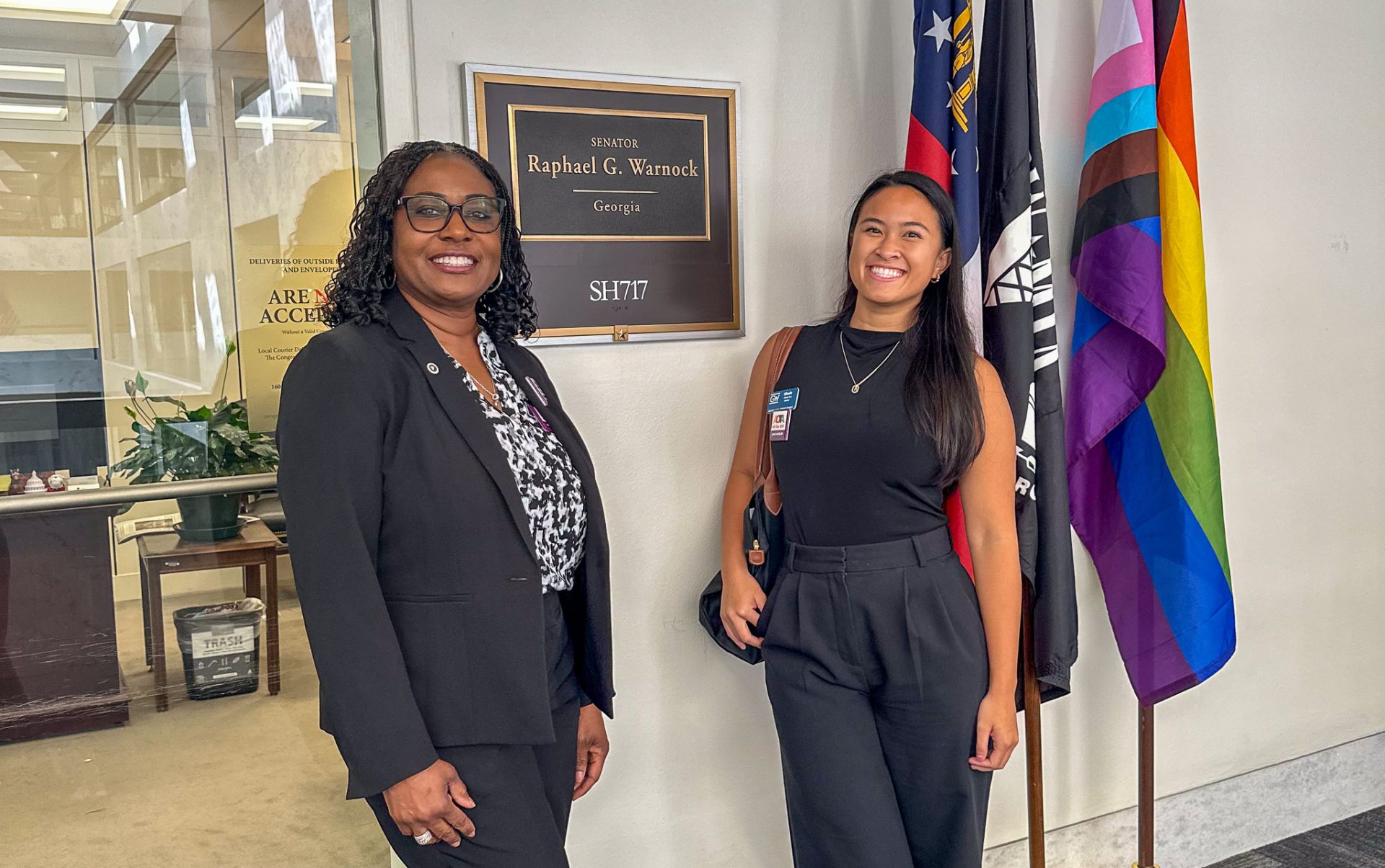 Nicole Train at Capitol Hill in front of representative office