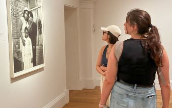 Portrait Gallery two students looking at black and white photo